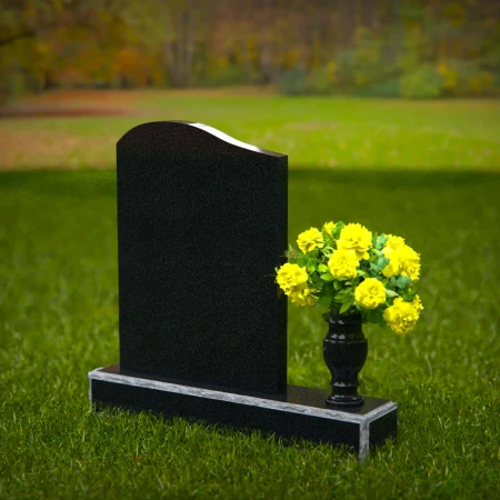 Elegant granite headstones with gently curved top and flower vase.