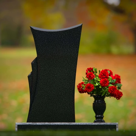 Contemporary granite headstones with unique shape and flower vase.