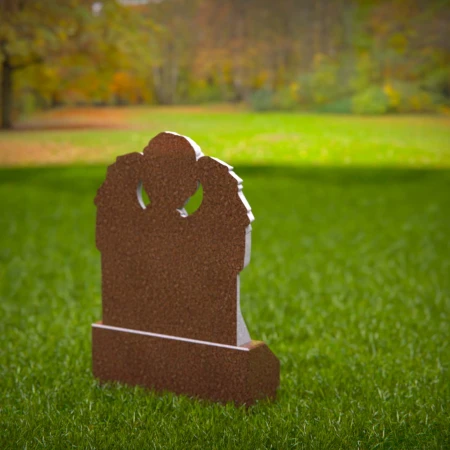 Reflective child tombstones carved with kneeling cherub angel