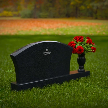 Contoured granite headstones with single flower vase for tribute.