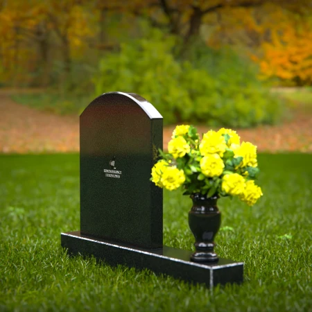 Classic arched granite headstones with polished vase tribute.