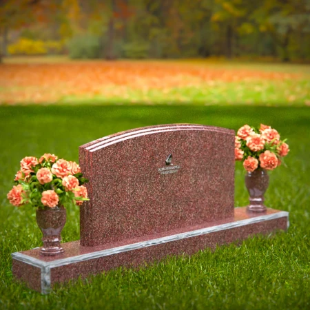 Dual vase headstones with arched design honoring shared memories.