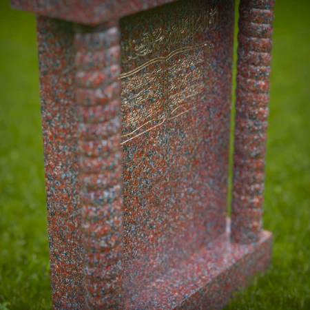Custom tombstones with cross-carved panels — elegant tribute with spiritual grace