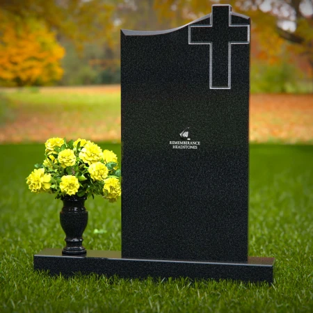 Upright granite headstones with cross design and flower vase.