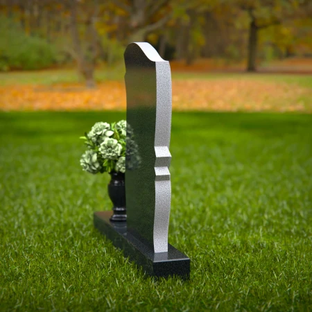 Elegant granite headstones with curved design and flower vase.