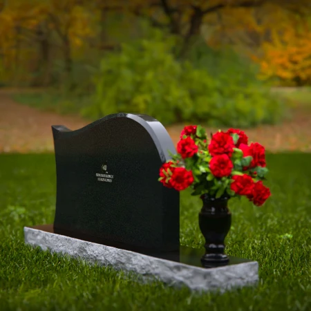 Modern waved granite headstones with flower vase for peaceful tribute.