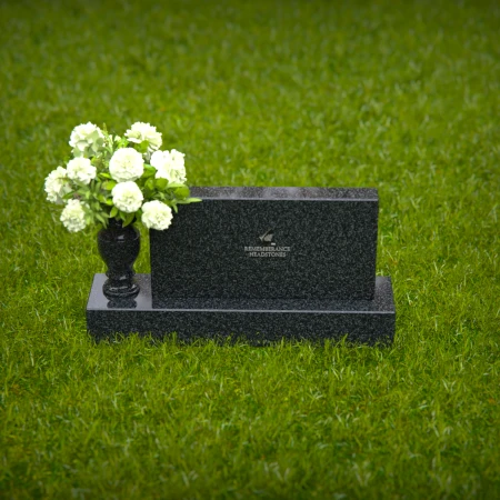Elegant headstones featuring custom memorial designs and flower vases.