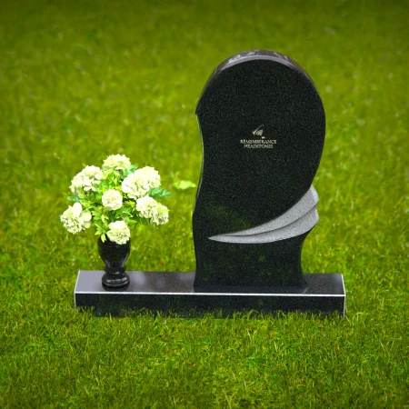 Contemporary headstones with curved artistic design and floral vase.