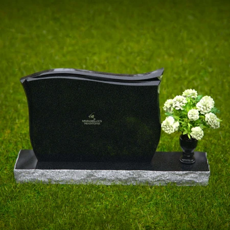Contoured granite headstones with polished finish and flower vase.
