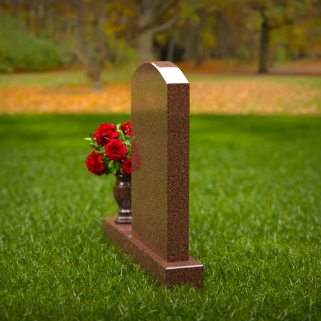Beautiful upright headstones with flower vase details.