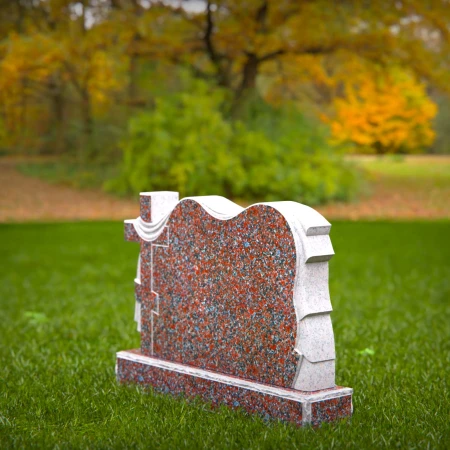 A meaningful cross tribute enhanced by elegant cloth motifs in headstone prices