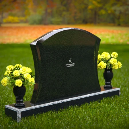 Waved granite headstones with dual flower vases for elegant tribute.