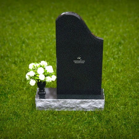 Elegant sloped headstones with floral vase for timeless tribute.
