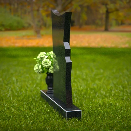 Contemporary headstones featuring a flowing design and floral vase.