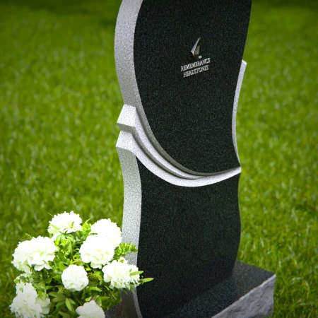 Modern heart-shaped granite headstones with elegant layered design.