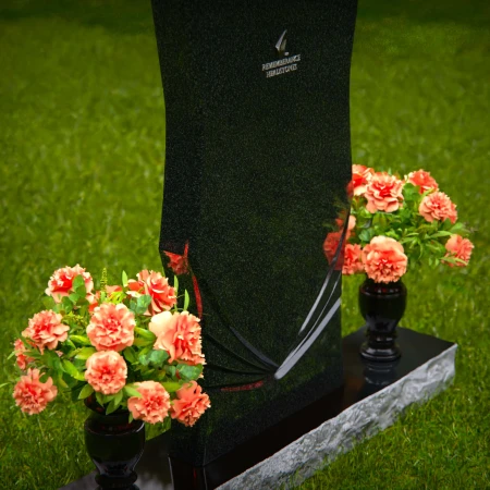 Elegant headstones with unique contours and dual flower vases.