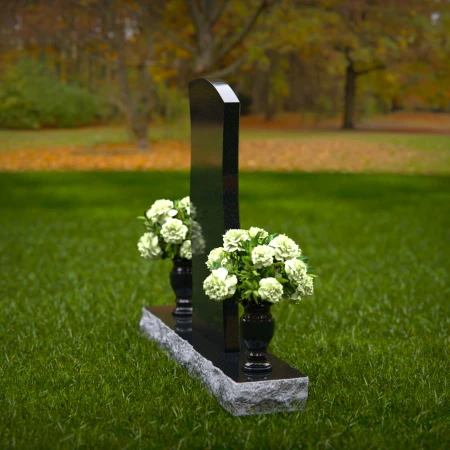 Elegant curved granite headstones with a timeless memorial design.