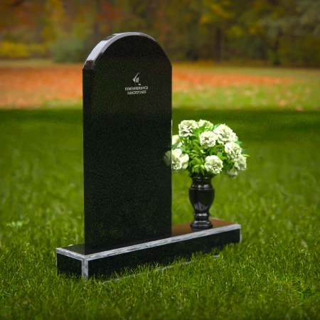 Classic arched headstones with a single flower vase for tribute.