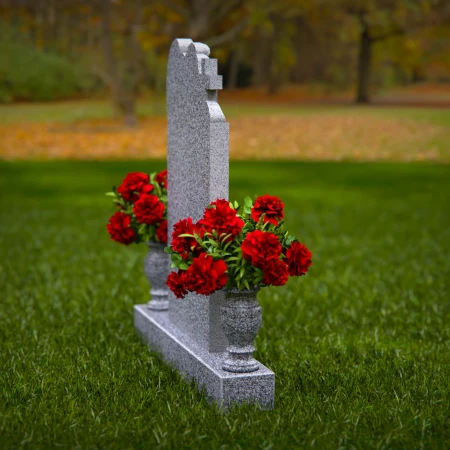 1911 - Angel Monument Embracing Cross with Floral Tributes