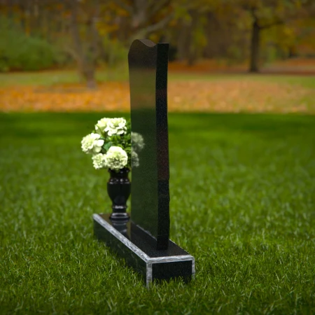 Modern waved granite headstones with elegant carved accents.