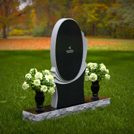 Modern oval granite headstones with layered base for elegant tribute.