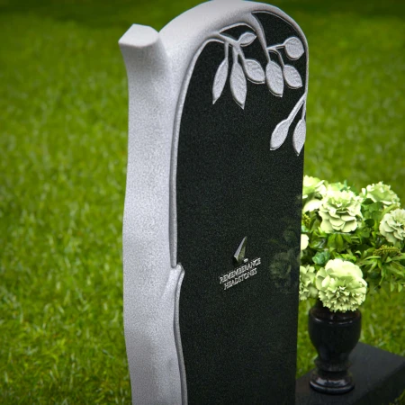 Elegant headstones featuring a tree design symbolizing growth and life.