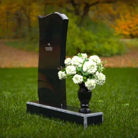 Modern curved granite headstones with engraved detailing for tribute.
