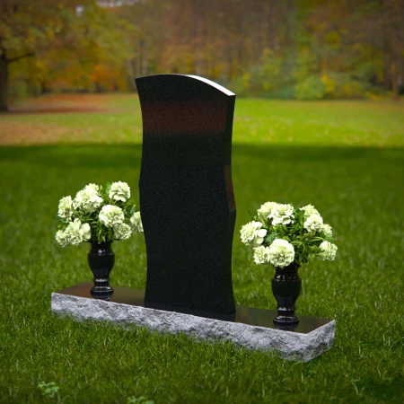 Elegant curved granite headstones with a timeless memorial design.