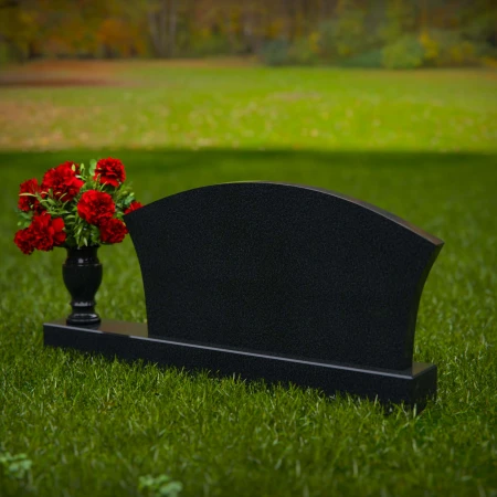 Contoured granite headstones with single flower vase for tribute.