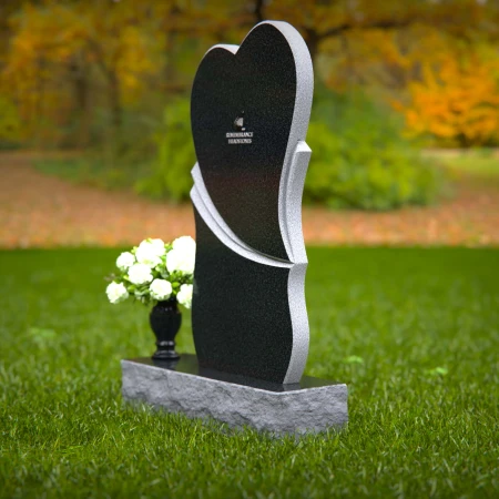 Modern heart-shaped granite headstones with elegant layered design.
