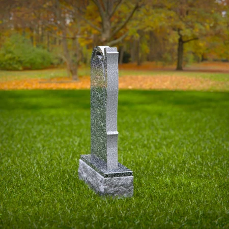 The sheltering arch over a life-giving tree defines these tombstones