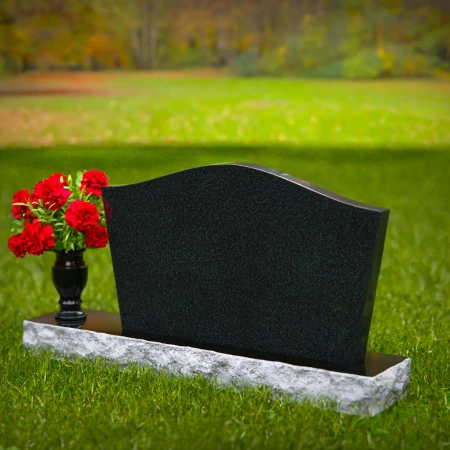 Waved granite headstones with single flower vase for graceful tribute.