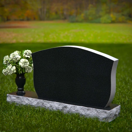 Elegant contoured headstones with flower vase for refined tribute.