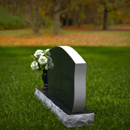 Elegant contoured headstones with flower vase for refined tribute.