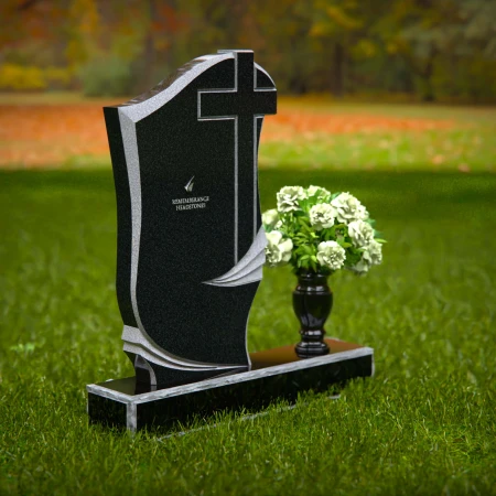 Traditional granite headstones with cross design and flower vase.