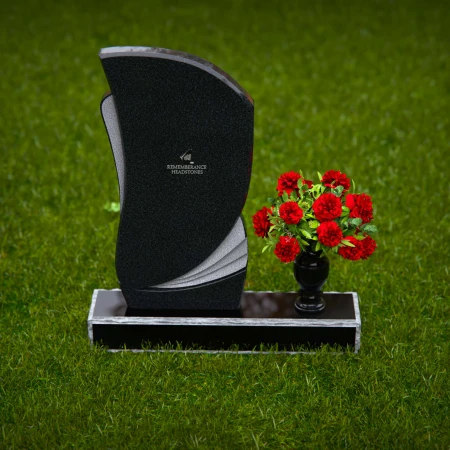 Modern headstones with artistic curves and a matching floral vase.