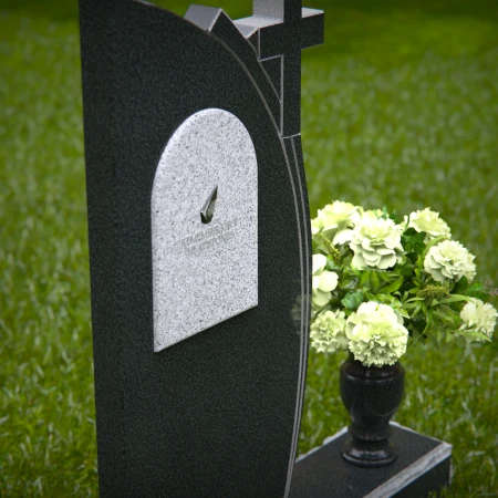 Unique headstones featuring a cross and elegant plaque design.