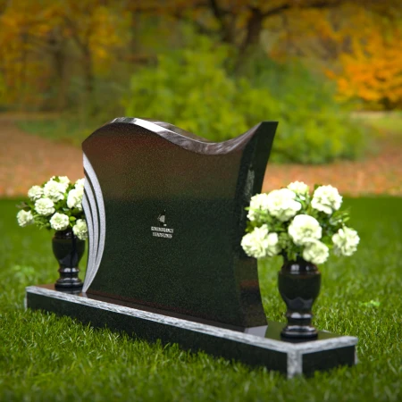 Elegant curved headstones with artistic detailing for a timeless tribute.