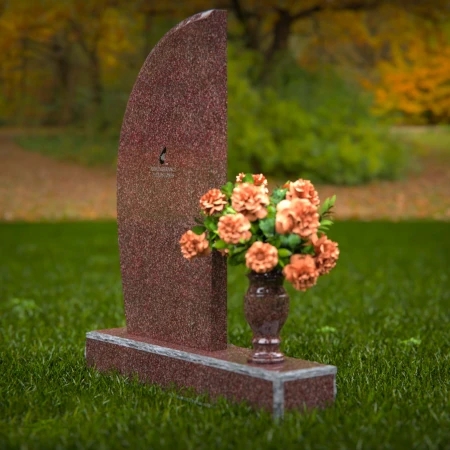 Contemporary headstones featuring sleek curves and floral vases.