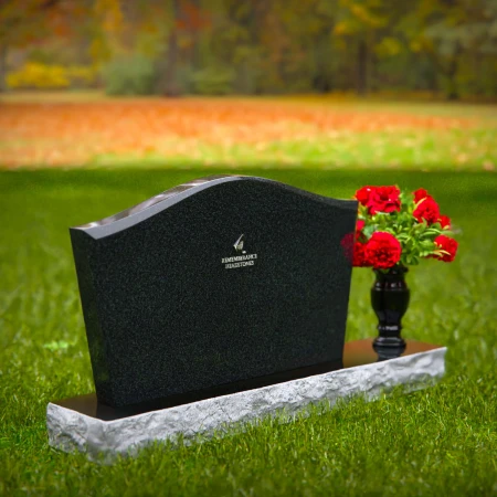 Waved granite headstones with single flower vase for graceful tribute.