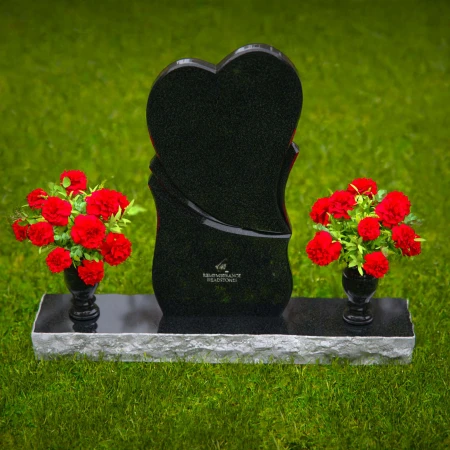 Unique dual heart headstones with twin flower vases for memorials.