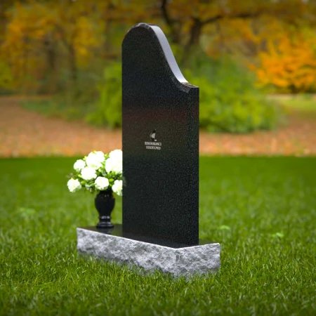 Elegant sloped headstones with floral vase for timeless tribute.