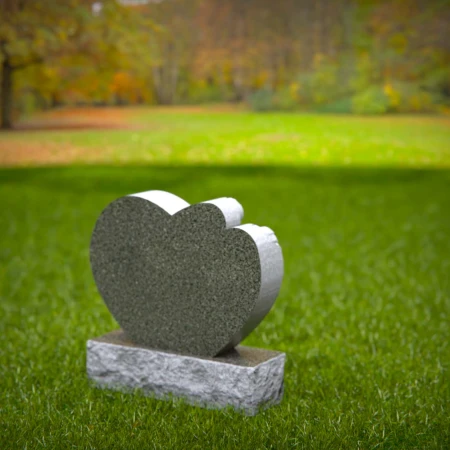 Grace-borne tombstones showing baby at rest on heartstone