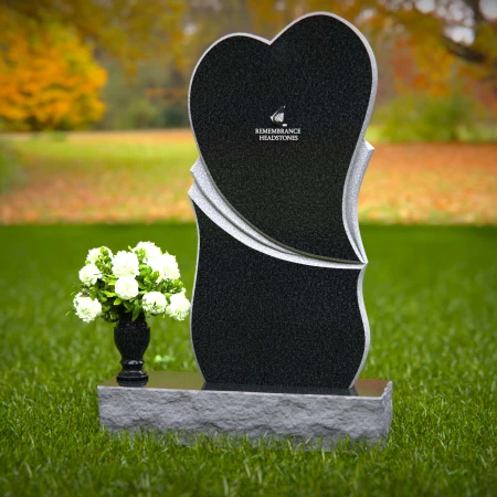 Modern heart-shaped granite headstones with elegant layered design.