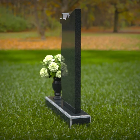 Unique headstones featuring a cross and elegant plaque design.