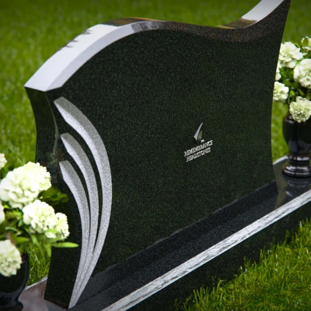Elegant curved headstones with artistic detailing for a timeless tribute.