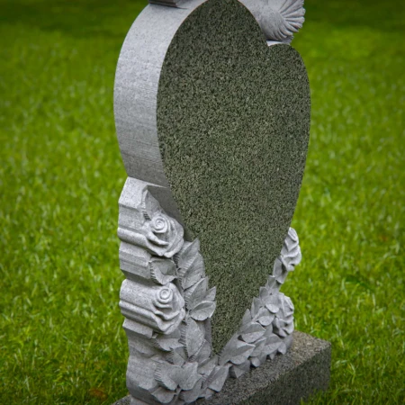 Doves rise around heart shape etched with floral memory in grave markers