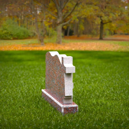 A meaningful cross tribute enhanced by elegant cloth motifs in headstone prices