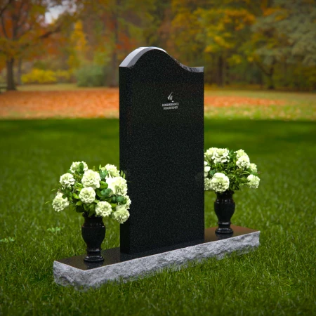Elegant upright headstones with floral arrangement for timeless tribute.