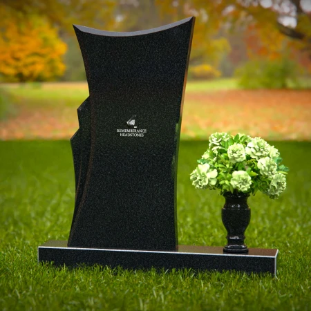 Contemporary headstones featuring a flowing design and floral vase.